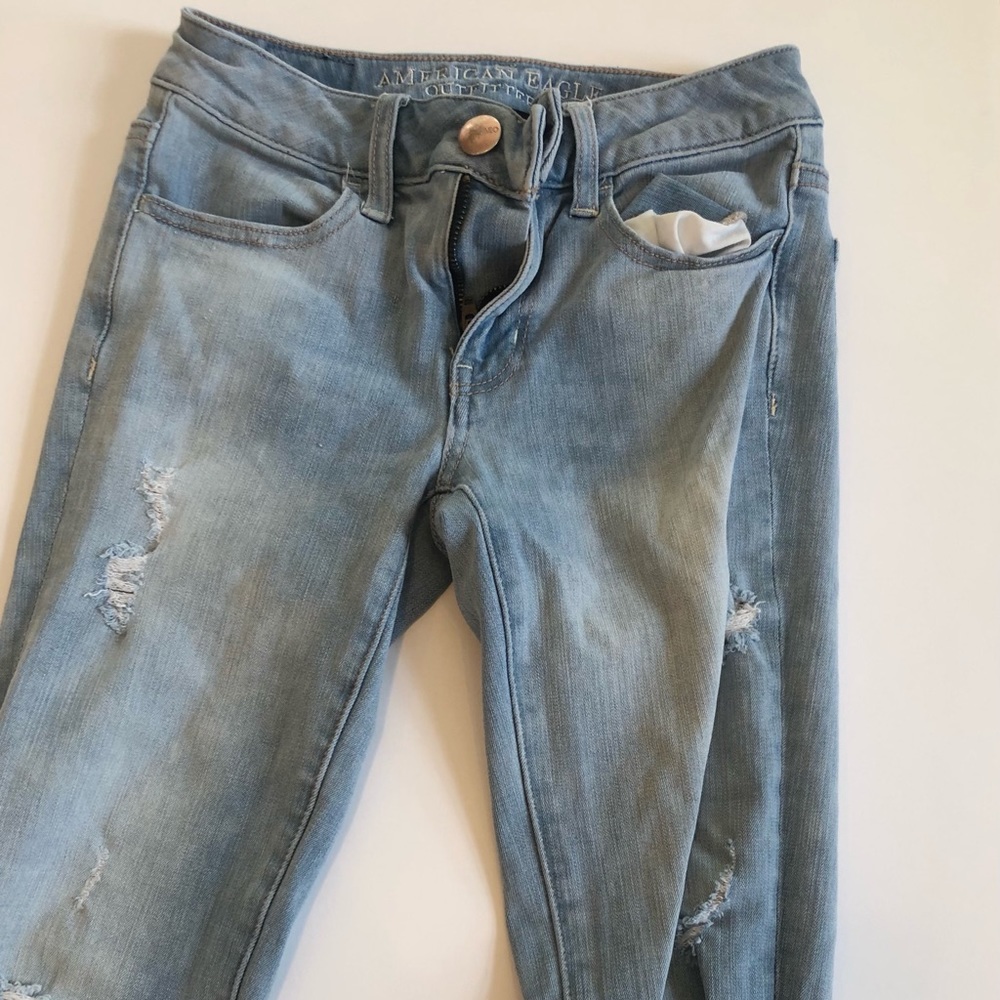 Light wash jeans with distressing